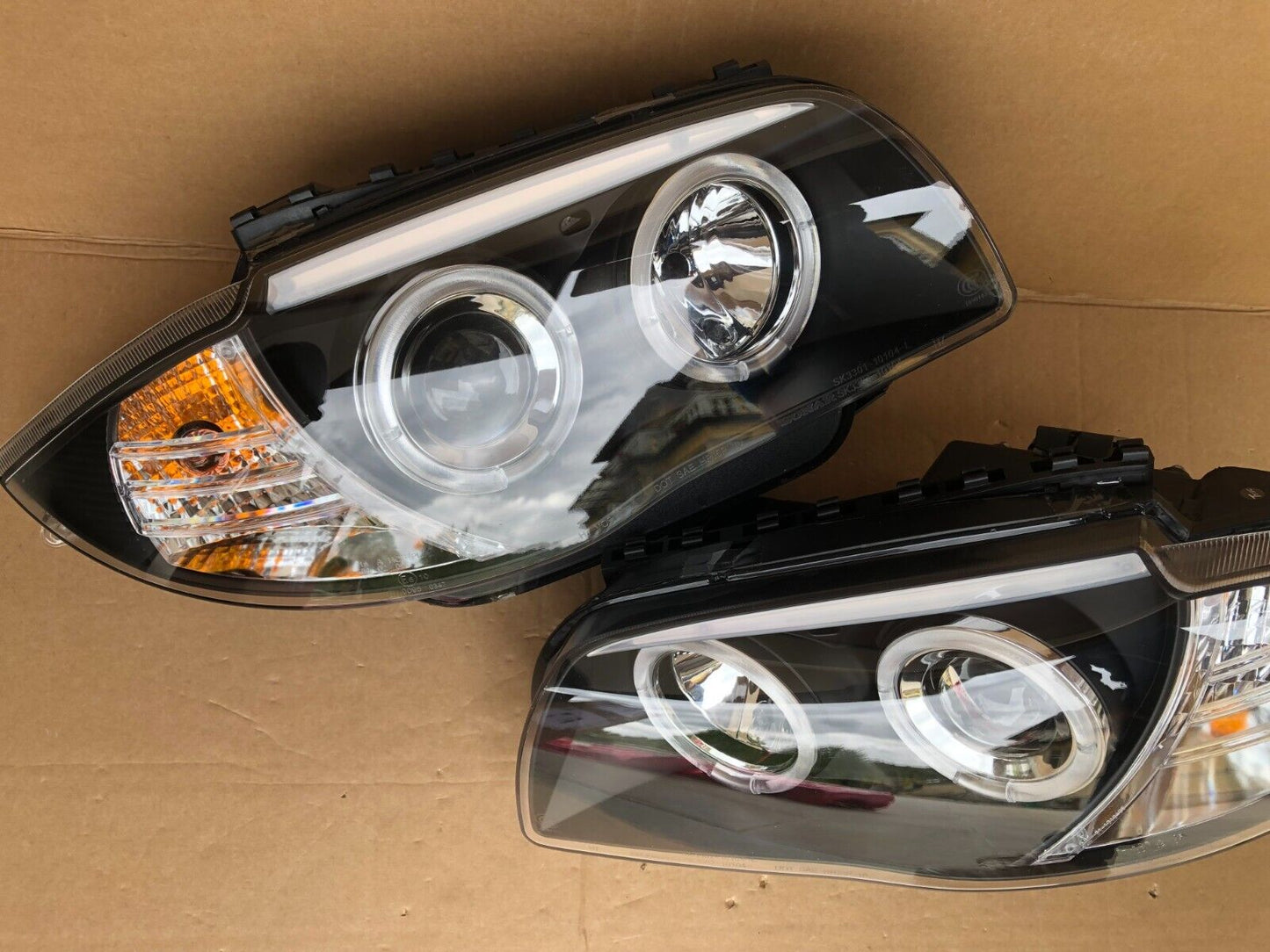 FARI ANTERIORI LED ANGEL EYES NERO PER BMW E81 E82 E87 E88 04-11 SERIE 1 FANALI